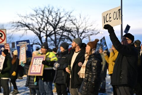 The Latest: Protesters gather outside Minneapolis immigration court after ICE officer kills driver