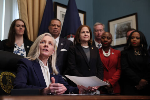 Virginia Gov. Abigail Spanberger signs executive orders after being sworn into office Jan. 17, 2026, in Richmond, Virginia. Spanberger is the first woman elected to the Commonwealth of Virginia’s highest office. The executive orders focused on affordability for Virginia residents. (Photo by Win McNamee/Getty Images)