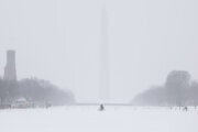 snow landscape in dc with washington monument in the distance
