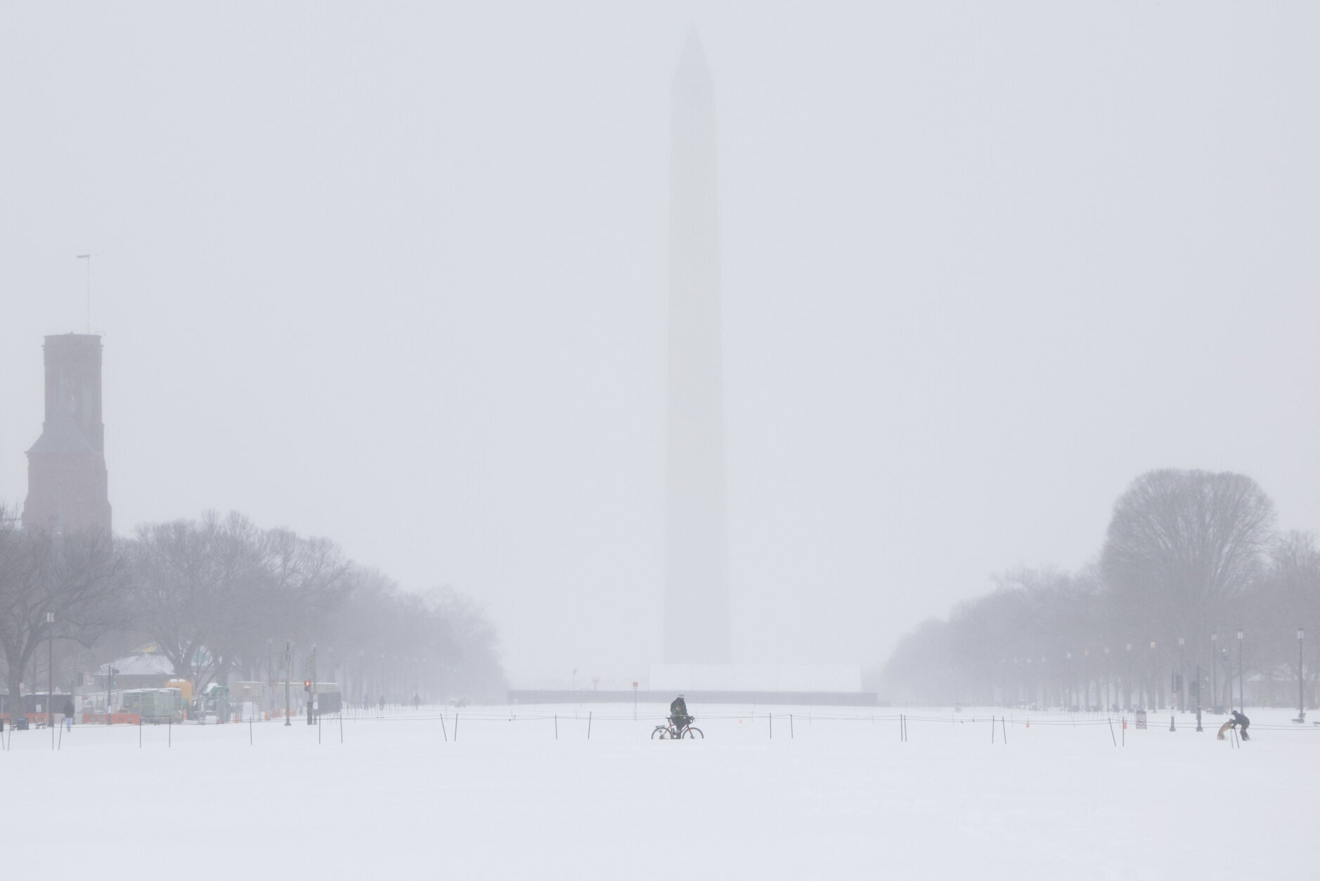 snow landscape in dc with washington monument in the distance