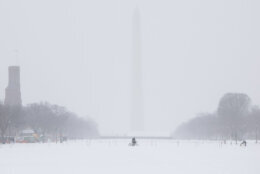 snow landscape in dc with washington monument in the distance