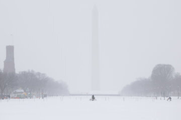snow landscape in dc with washington monument in the distance