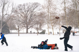 Children play football in the snow