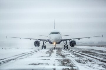 Airliner on runway in blizzard