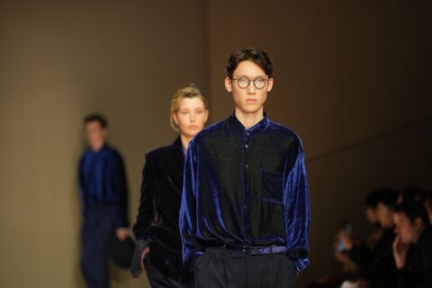 Giorgio Armani launches new era with iridescent colors and a star-studded front row