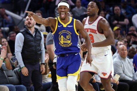 Warriors guard Jimmy Butler goes down with apparent knee injury in 3rd quarter against Heat