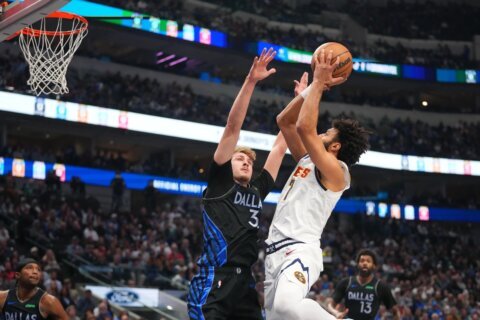Cooper Flagg sprains an ankle and is ruled out after halftime for Mavs against Nuggets