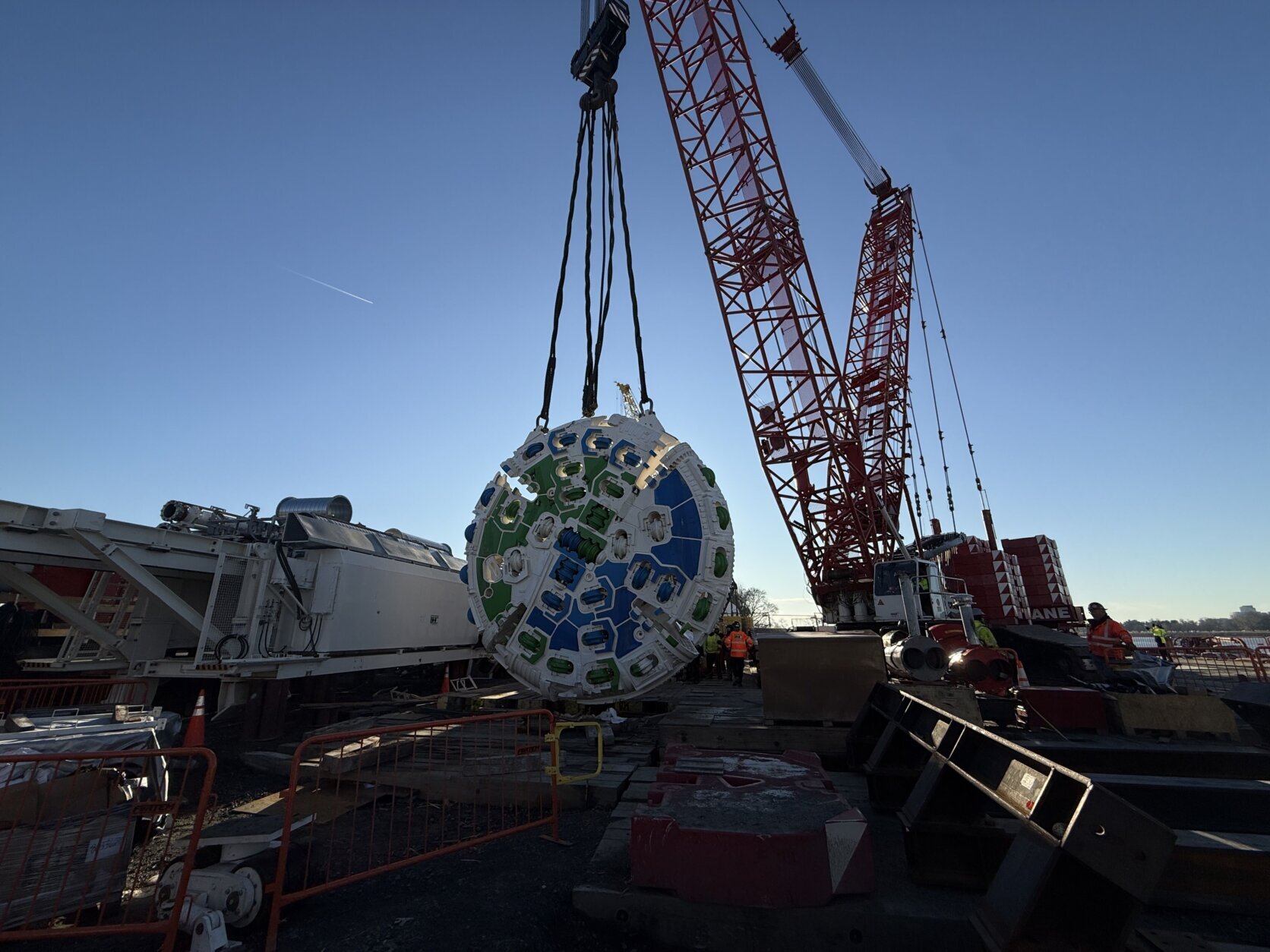machine lowered to burrow tunnel