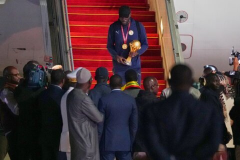 Senegal President greets team as triumphant players receive heroes welcome in Dakar