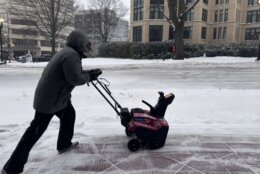 Worker clears sidewalk in Maryland