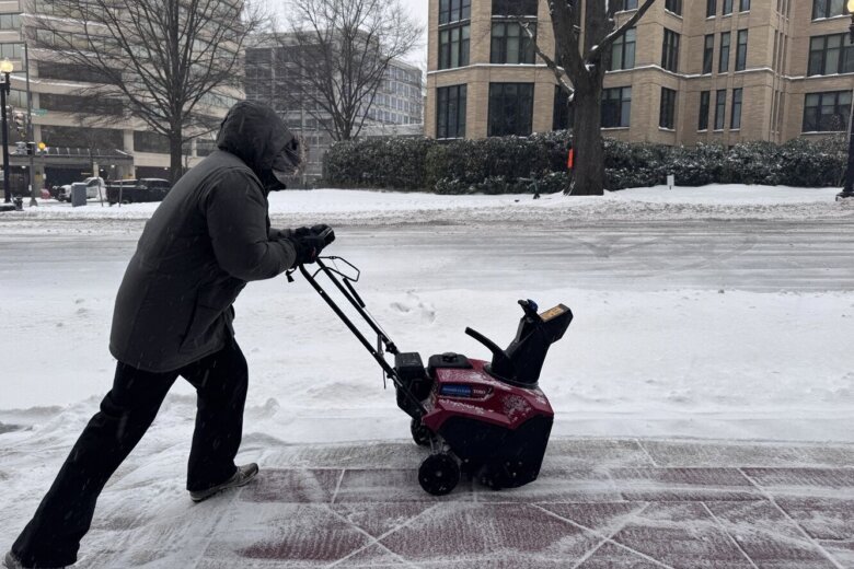 Worker clears sidewalk in Maryland