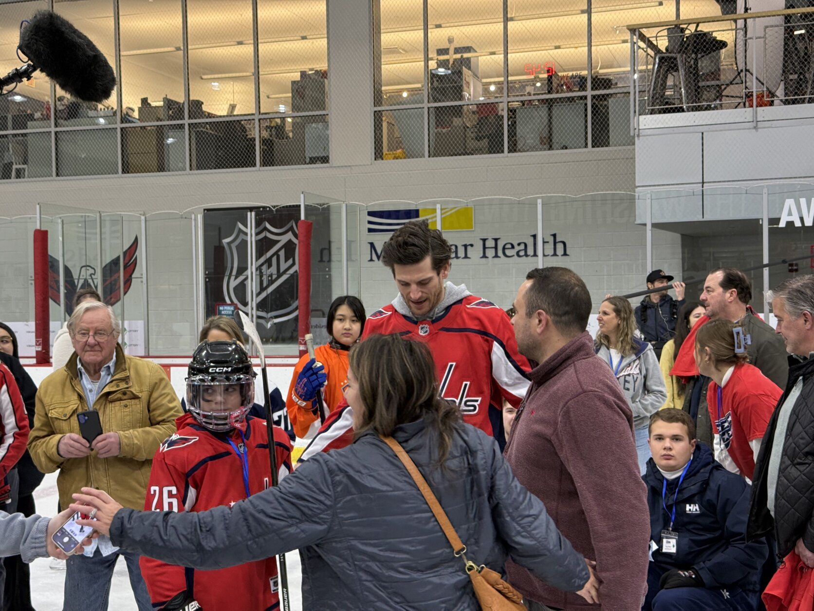 caps players with kids on the ice