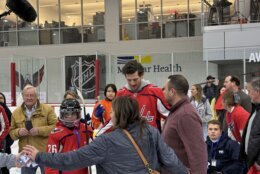 caps players with kids on the ice