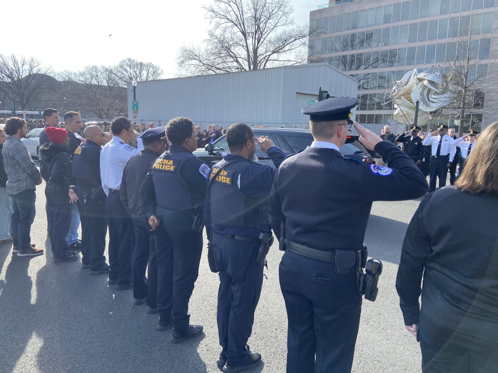 Officers saluted as the procession drove by, WTOP's Scott Gelman reported.