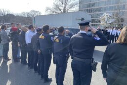 Officers saluted as the procession drove by, WTOP's Scott Gelman reported.