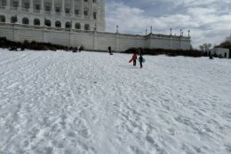 With schools closed and snow remaining on the ground, a small crowd gathered near the U.S. Capitol to go sledding on Jan. 26, 2026.