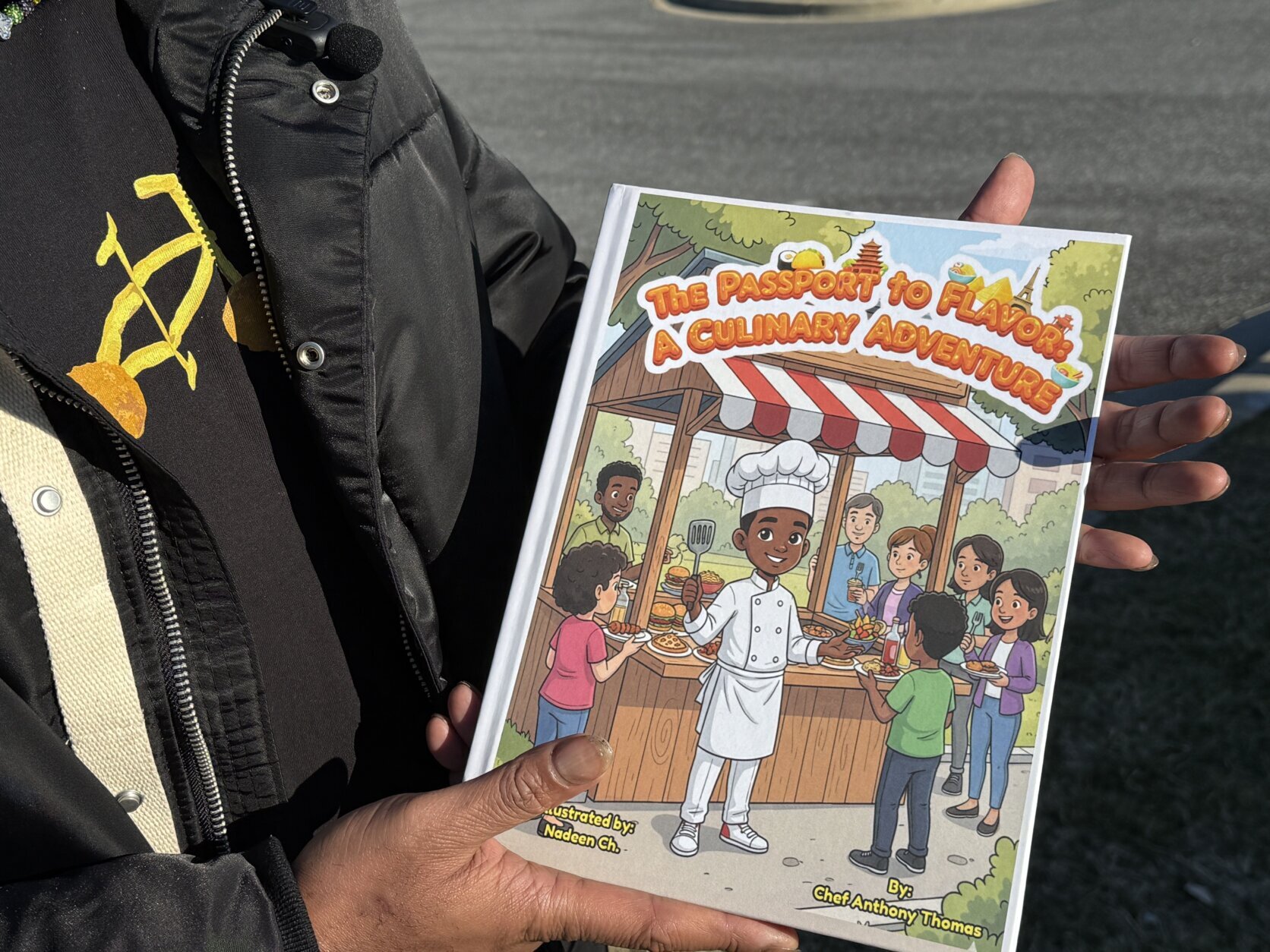 thomas holds his children's book