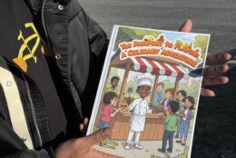 thomas holds his children's book