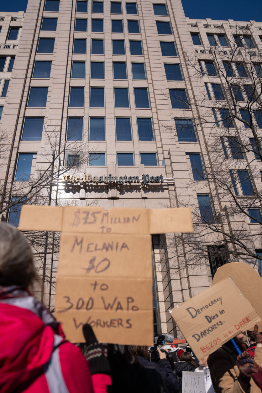 Protesters outside of the Washington Post office demonstrate following a mass layoff, Thursday, Feb. 5, 2026, in Washington. (AP Photo/Allison Robbert)