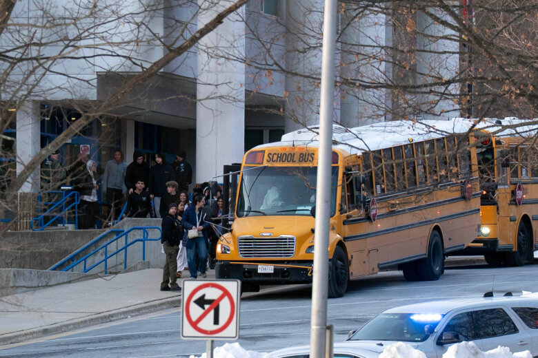Thomas S. Wootton High School students leave the school after lockdown and board a school bus to take them to reunite with their parents in Rockville Md., Monday, Feb. 9, 2026, after a person was shot inside the school. (AP Photo/Jose Luis Magana)
