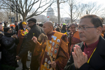 With the Capitol in the background, Bhikkhu Pannakara, center, leads his fellow Buddhist monks near the Peace Monument on Capitol Hill, during the Walk for Peace, in Washington, Wednesday, Feb., 11, 2026. (AP Photo/Rod Lamkey, Jr.)