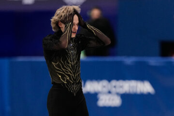 figure skater with hands on head in disappointment
