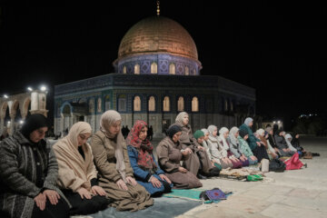 Muslim worshippers perform the evening Tarawih prayers during the holy fasting month of Ramadan, next to the Dome of Rock shrine at the Al-Aqsa Mosque compound in Jerusalem's Old City, Tuesday, Feb. 17, 2026. (AP Photo/Mahmoud Illean)