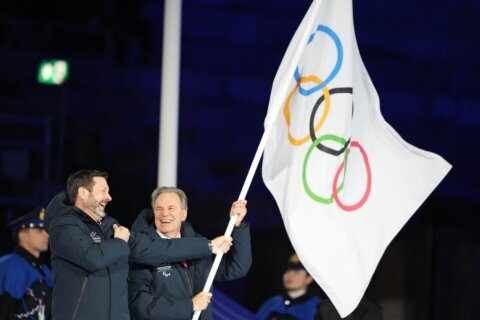 Twin Milan and Cortina Olympic cauldrons are extinguished, signaling the end of Winter Games