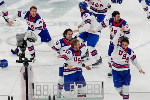 The victory lap for America’s Olympic hockey champions quietly shed politics from the celebration