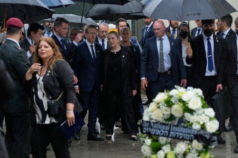 Israel’s president visits Sydney’s Bondi Beach massacre site and  meets victims’ families