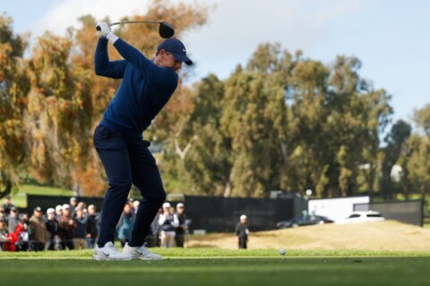 Rory McIlroy handles the rain and then wind to share clubhouse lead at Riviera