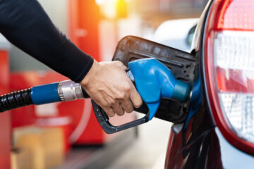 Man pumping gasoline into his car