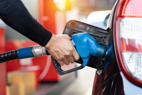Man pumping gasoline into his car