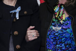 WASHINGTON, DC - DECEMBER 15: Sen. Maria Cantwell (D-WA) (L) comforts Christina Stovall (R), who lost her son Michael "Mikey" Bret Stovall, during a press conference with families who lost loved ones in the January 29, 2025 DCA plane crash on December 15, 2025 at the U.S. Capitol in Washington, DC. The bipartisan press conference addressed the National Defense Authorization Act (NDAA) language, which changes military airspace policy. (Photo by Heather Diehl/Getty Images)