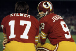 Hall of Fame quarterback Sonny Jurgensen (9) of the Washington Redskins talks with backup Billy Kilmer during the Redskins 14-7 victory over the Dallas Cowboys on October 8, 1973 at RFK Stadium in Washington, D.C. (Photo by Nate Fine/Getty Images)