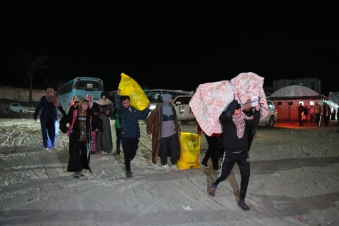 Palestinians attempt to cross between Gaza and Egypt at the Rafah border crossing