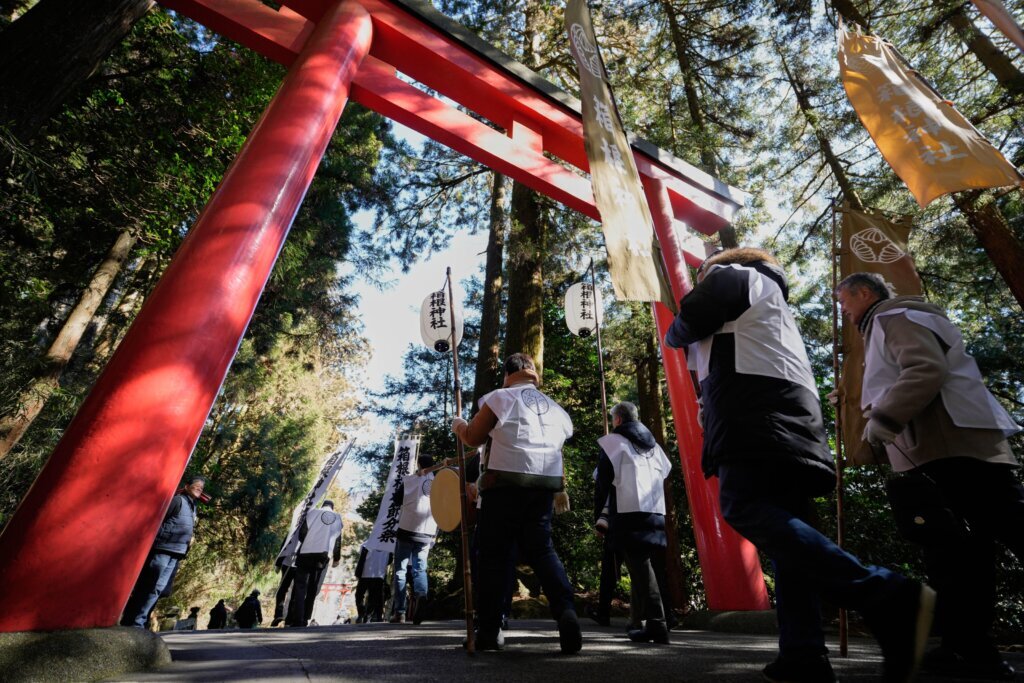 Photos of a bean-throwing ritual to celebrate seasonal change and ward off evil at a Japanese shrine