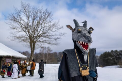 Photos show masked revelers celebrating Shrovetide in Lithuania