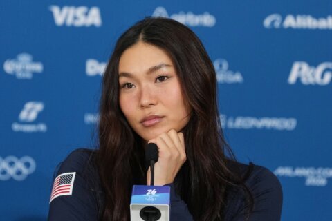 US snowboard star Chloe Kim calls for unity after Trump bashes teammate over immigrant crackdown