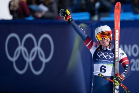 Breezy Johnson wins Olympic downhill on day marred by American teammate Lindsey Vonn's crash