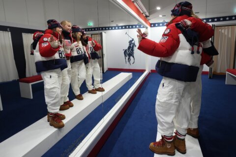 US Olympians are greeted at Milan's airport with star-spangled Ralph Lauren uniforms