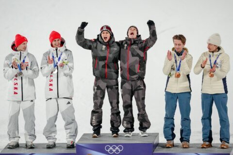 Austria wins gold in 1st Olympic men’s super team ski jump as event is shortened due to weather