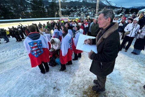 French artist finds happiness drawing spectators at his 17th Olympics in Cortina