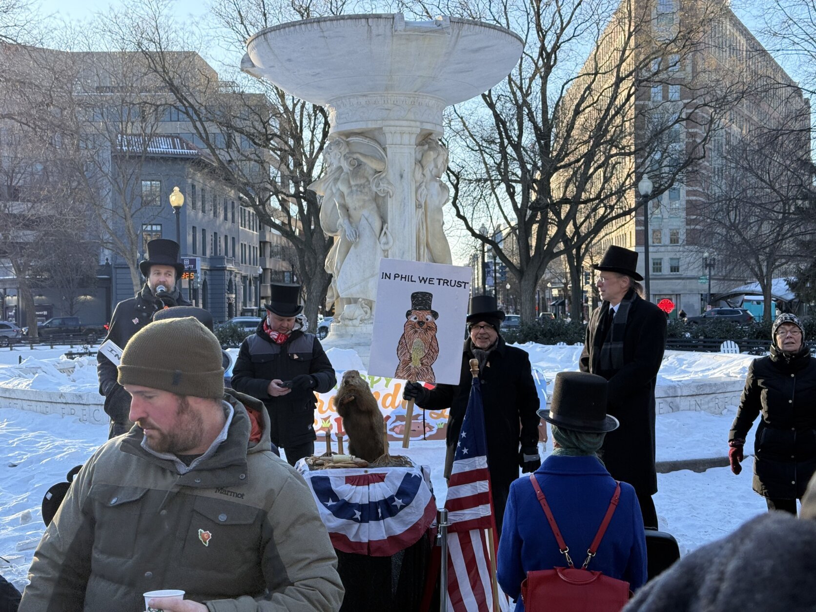 crowd gathers to hear potomac phil's weather prediction in dupont circle