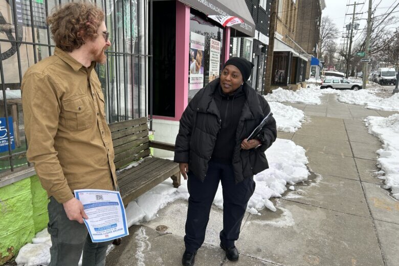 a man and a woman outside a business