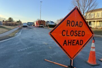 a sign on a blocked road