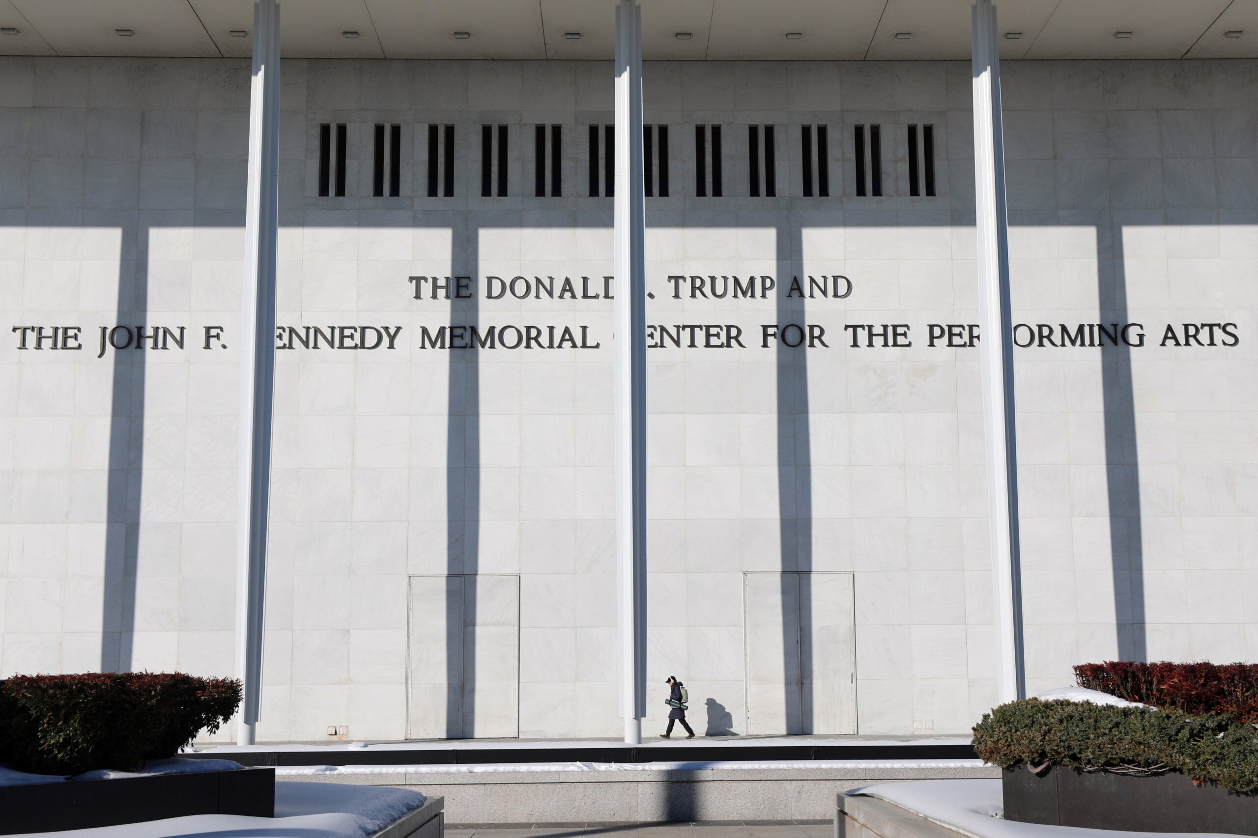 A woman walks outside The John F. Kennedy Memorial Center