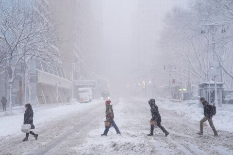 Powerful winter storm roils travel across the US, leading to thousands of flight cancellations