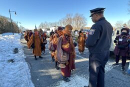 <p>Alexandria Police Chief Tarrick McGuire gifted a badge to Venerable Bhikkhu Pannakara on Feb. 9, 2026.</p>

