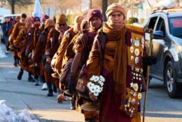 Led by Bhikkhu Pannakara (R), Buddhist monks participate in a "Walk for Peace" in Richmond, Virginia,